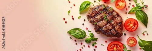Beef steak with tomatoes and spices on a pink background.