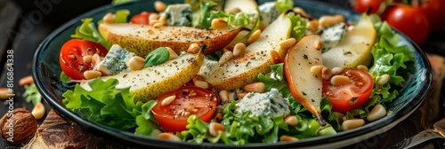 Fruit Salad with Sliced Pears, Gorgonzola Cheese, Greens and Pine Nuts Close Up. Fruit Salat
