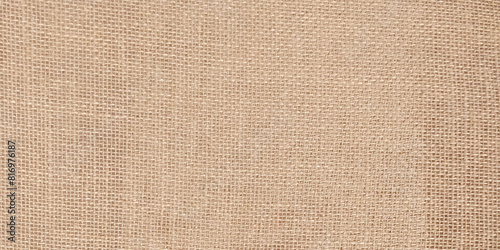 Brown light linen texture or background for your design. Beige textile linen tablecloth in full frame. Cloth texture background. Copy space. Banner. High quality photo