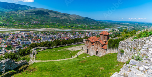 A panorama view past Saint Theodores Church in the castle above the city of Berat, Albania in summertime