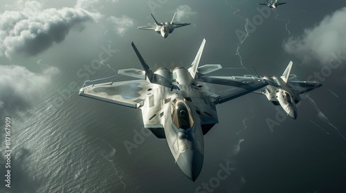 Three F-22 Raptor stealth fighter jets in flight over a body of water with clouds in the background
