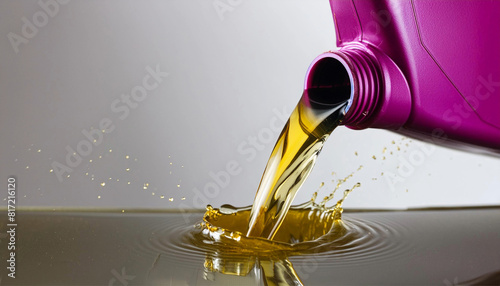Synthetic lubricating oil is poured out into a splash lubrication system/ oil reservoir