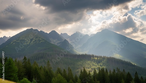 tatra mountains seen on a cloudy day the shining light between the clouds creates an interesting atmosphere in the photo