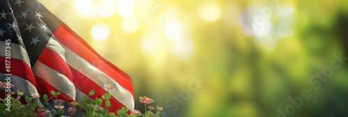 The American flag drapes across flowers with a glowing, bokeh background symbolic of patriotism