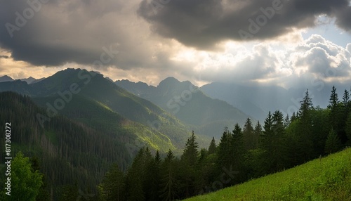 tatra mountains seen on a cloudy day the shining light between the clouds creates an interesting atmosphere in the photo
