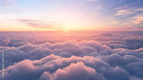 View of the sky from above with the sun rising over the horizon