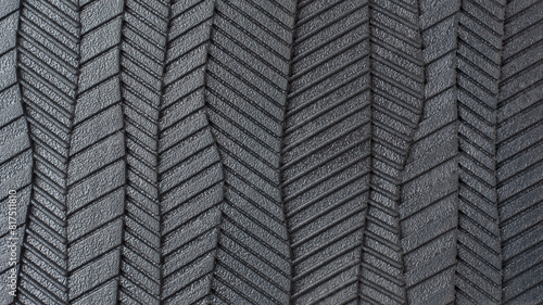 close-up view of sole of shoe pattern, abstract of black rubber textured and grooves surface of bottom of footwear in full frame, macro background or wallpaper for designing