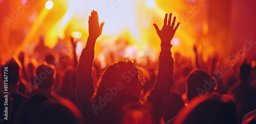 Spiritual Gathering with Raised Hands in Vibrant Atmosphere.