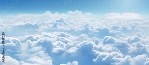 A view from above of a sky filled with fluffy clouds Copy space image