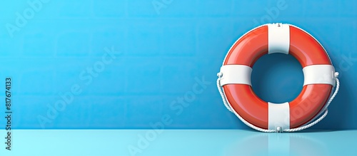 A lifebuoy is displayed against a vibrant blue backdrop providing ample space for text