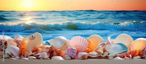 Sea shells on a colorful sea wave backdrop Perfect for summer vacation themes Ideal for adding text Copy space image