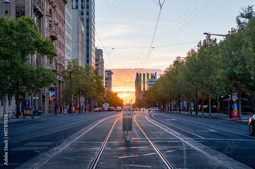 View along tram tracks at North Terrace Adelaide at sunset