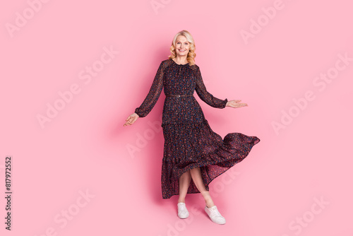 Full size photo of pretty aged lady dance throw dress isolated on pink color background