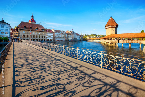 Lucerne city, Switzerland, view of the historical Old town and famous wooden Chapel Bridge in the sunset light