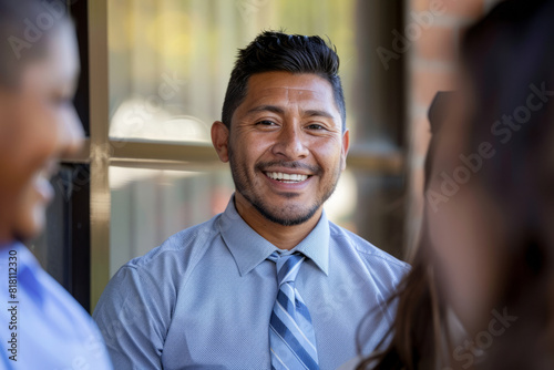 A Hispanic businessman, leading a mentorship program for at-risk youth in his community, providing guidance and support to help them overcome obstacles and achieve their full potential, his investment