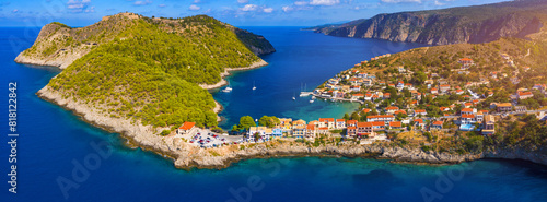 Assos village in Kefalonia, Greece. Turquoise colored bay in Mediterranean sea with beautiful colorful houses in Assos village in Kefalonia, Greece, Ionian island, Cephalonia, Assos village.