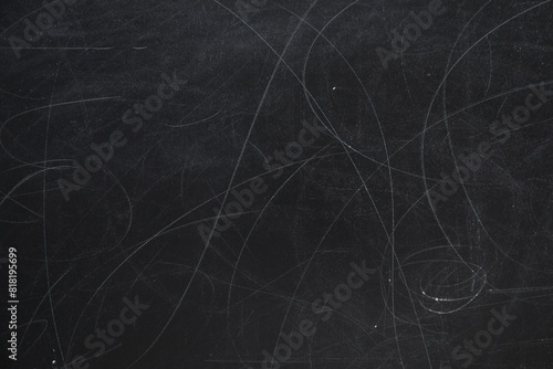 Chalk rubbed out on blackboard as background, closeup. Space for text