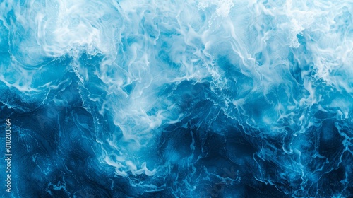  A close-up of a wave in the ocean, with its bottom painted blue and white, submerged in the water's midsection