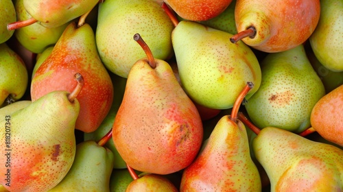  A stack of pears atop another stack, both filled with ripe fruits beside each other