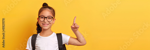 A little schoolgirl on a yellow background shows various gestures, a banner.