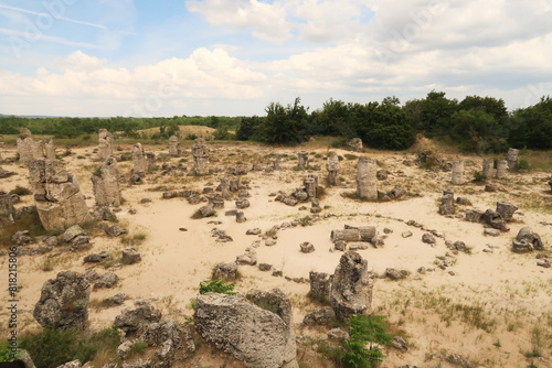 View over the stone forest of Pobiti Kamani, a stone circle between many stone pillars rising from a desert-like landscape near Varna, Bulgaria