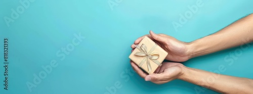 Someone gives a gift with two hands.