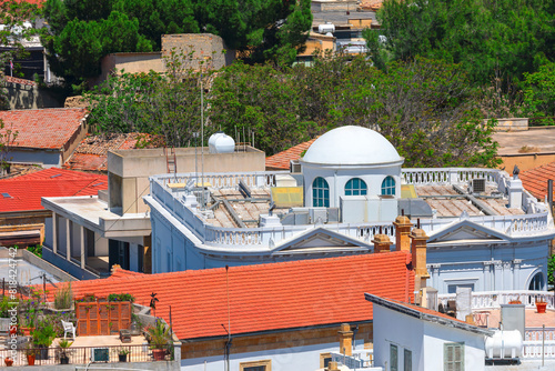 View of the old town with tiled roofs and cupola on the rooftop