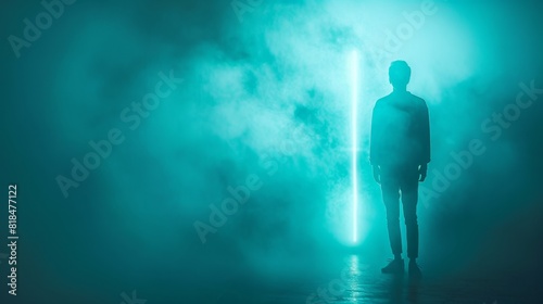 Faceless figure illuminated by neon lights, standing on a minimal teal background with space for text