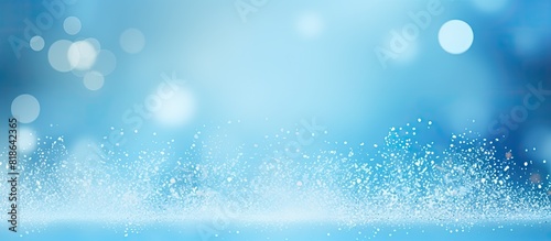 The light blue background features a captivating display of white bokeh leaving ample copy space for additional images