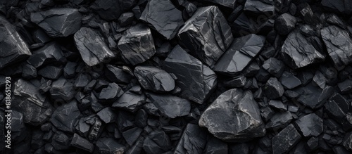 A background image displaying the texture of black rocks with space available for adding other elements. with copy space image. Place for adding text or design