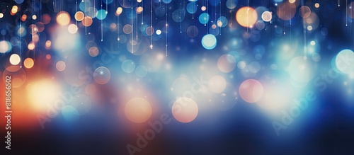An abstract and blurred bokeh background with Christmas lights creating a beautiful copy space image