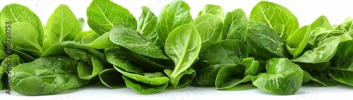 A Caesar salad with crisp greens, viewed from the top and set against a white background