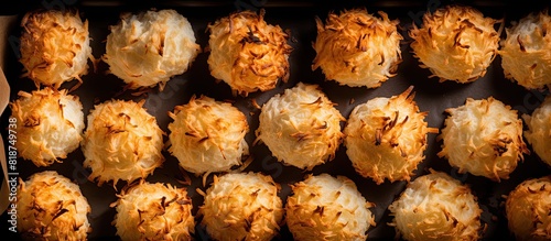 A top view image showcasing delicious homemade coconut macaroons baking in the oven with copy space available