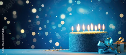 Happy birthday greetings for a 13 year old featuring lit candles and festive decorations on a beautiful blue background Copy space image