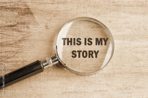 Business and my story concept. Text This is my story visible through a magnifying glass on an old faded background