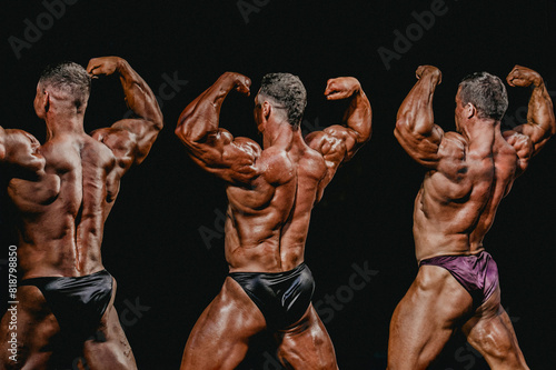 group bodybuilder athlete show back double biceps for bodybuilding competition