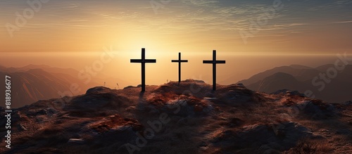 At sunrise there is a copy space image of three crosses being crucified on a hill