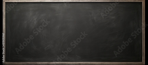 Image of a blank chalkboard with erased marks providing a clean surface for educational purposes. copy space available