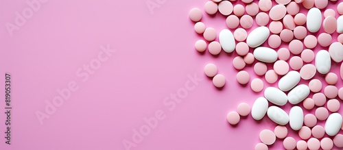 Medicine background pharmacy Pharmaceutical pills on pink backdrop Flat lay image. copy space available