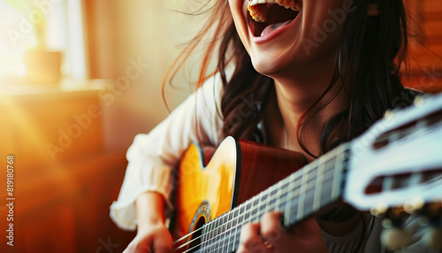 Happy Woman Playing Guitar and Singing - Feel the music with this image of a happy woman playing guitar and singing, perfect for illustrating passion or artistic expression