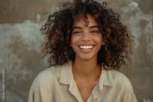 Digital artwork of woman smiling with curly hair is wearing a beige shirt