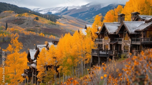 Residences on the mountain side of Bachelor Gulch with golden Fall foliage