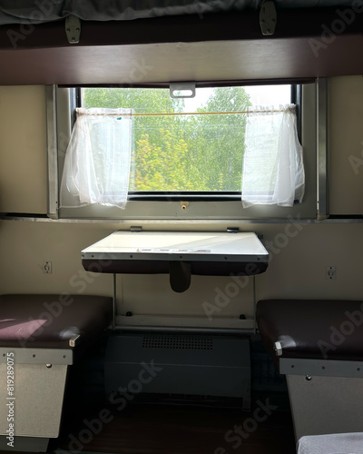 Soviet russian couchette car, railway carriage, window with white curtains