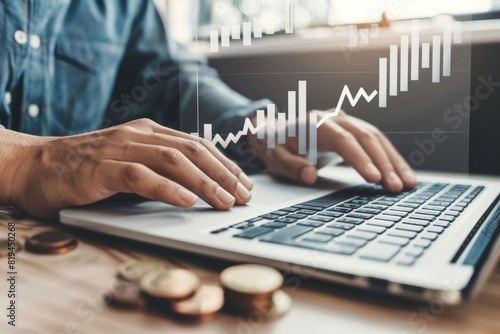 The concept of business growth with coins and graphs, in a flat lay composition on a wooden table, with a businessman using a laptop in the background,