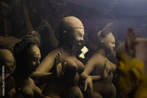 idol of goddess durga during durga puja festival. The unfinished idol is made of clay being sculpted.