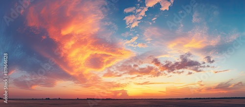A sunset at the airport features cirrocumulus clouds with a striking appearance resembling fire providing an ideal backdrop for a copy space image