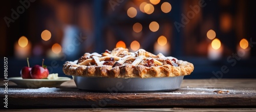 A delectable pie displayed on a rustic wooden table with a blurred background giving emphasis on the subject featuring copy space image