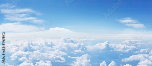 White cloud floating in the vast expanse of the clear blue sky creating a serene and peaceful atmosphere in the scene with copy space image