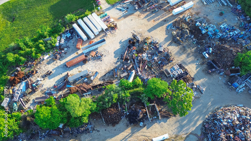 Large recycling center mound of ferrous and nonferrous scrap metals, vehicle parts, old appliances, copper, aluminum, electronic trash, Mountain Grove, Missouri, environmental risks, aerial view