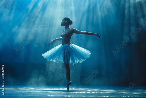 Young ballerina ballet dancer in a tutu on stage